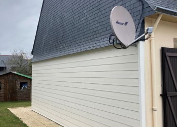 Pignon de la photo avec un ITE en finition bardage PVC